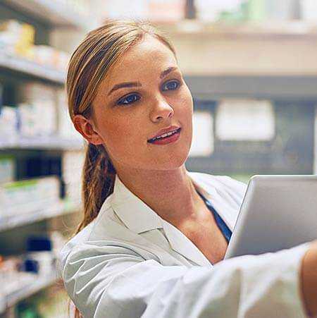 A medical professional holding mobile device